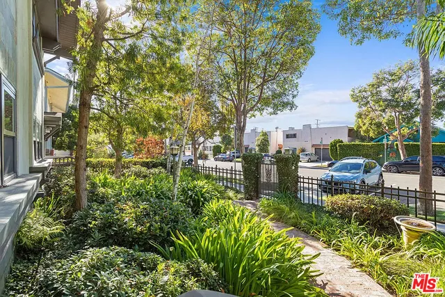 a view of a chair and table in the garden