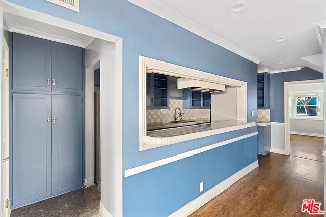 a view of room with wooden floor