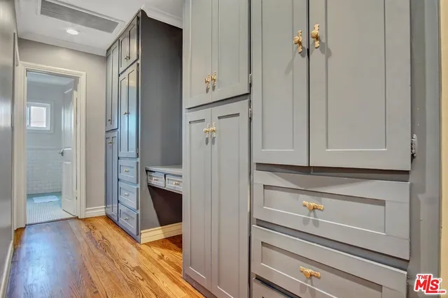 a view of hallway with wooden floor