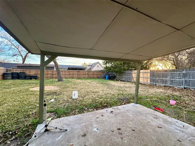a view of a backyard with porch