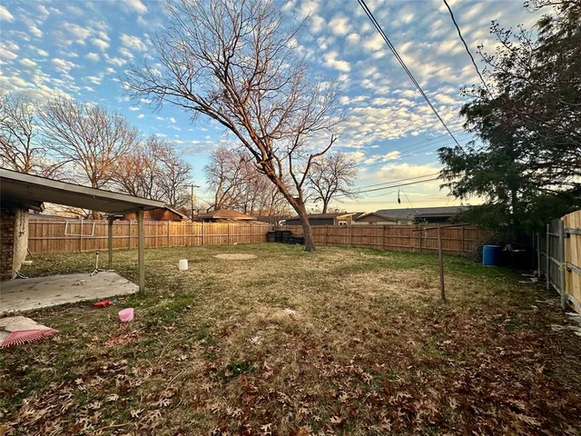 a view of backyard with green space