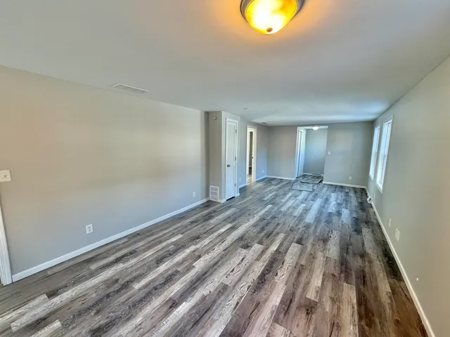 a view of a yard with large trees