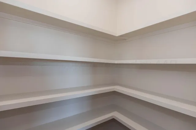 a view of empty room with windows