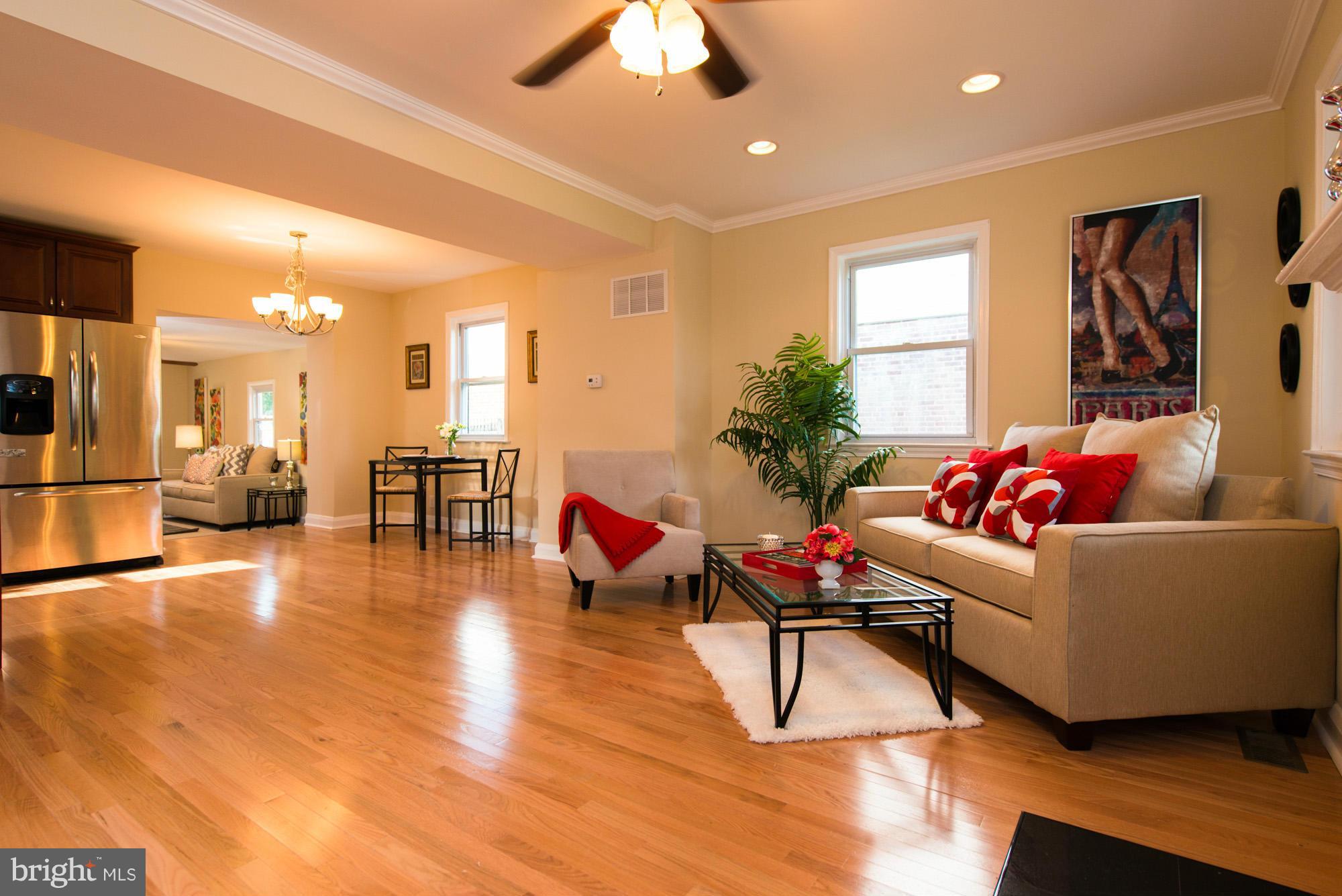 6812 Dunhill Road Baltimore, MD 21222 - Photo 5 of 30 a living room with furniture and a wooden floor