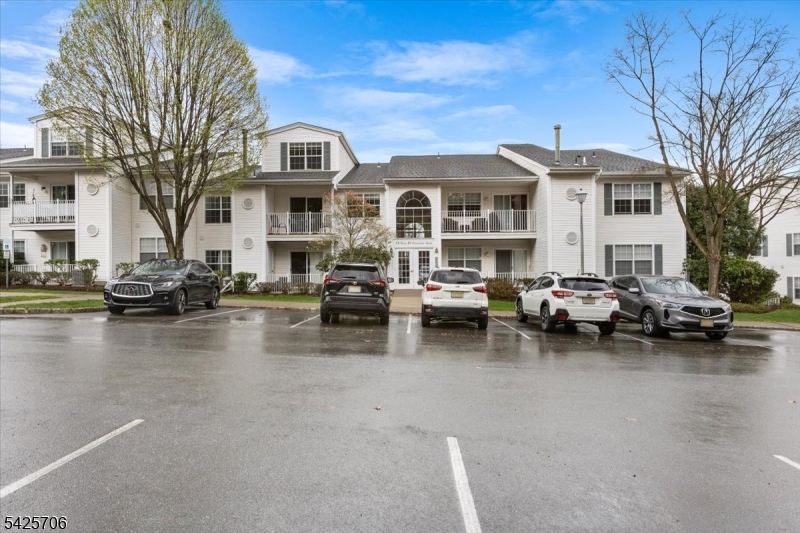 75 Crestview Lane Mount Arlington, NJ 07856 - Photo 1 of 27 a view of a building with cars parked in front of it