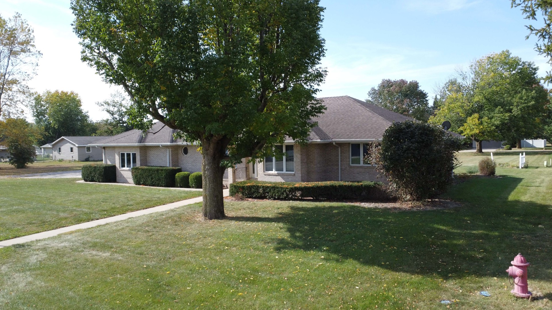 601 Church Street Crescent City, IL 60928 - Photo 2 of 60 a front view of a house with a yard and trees
