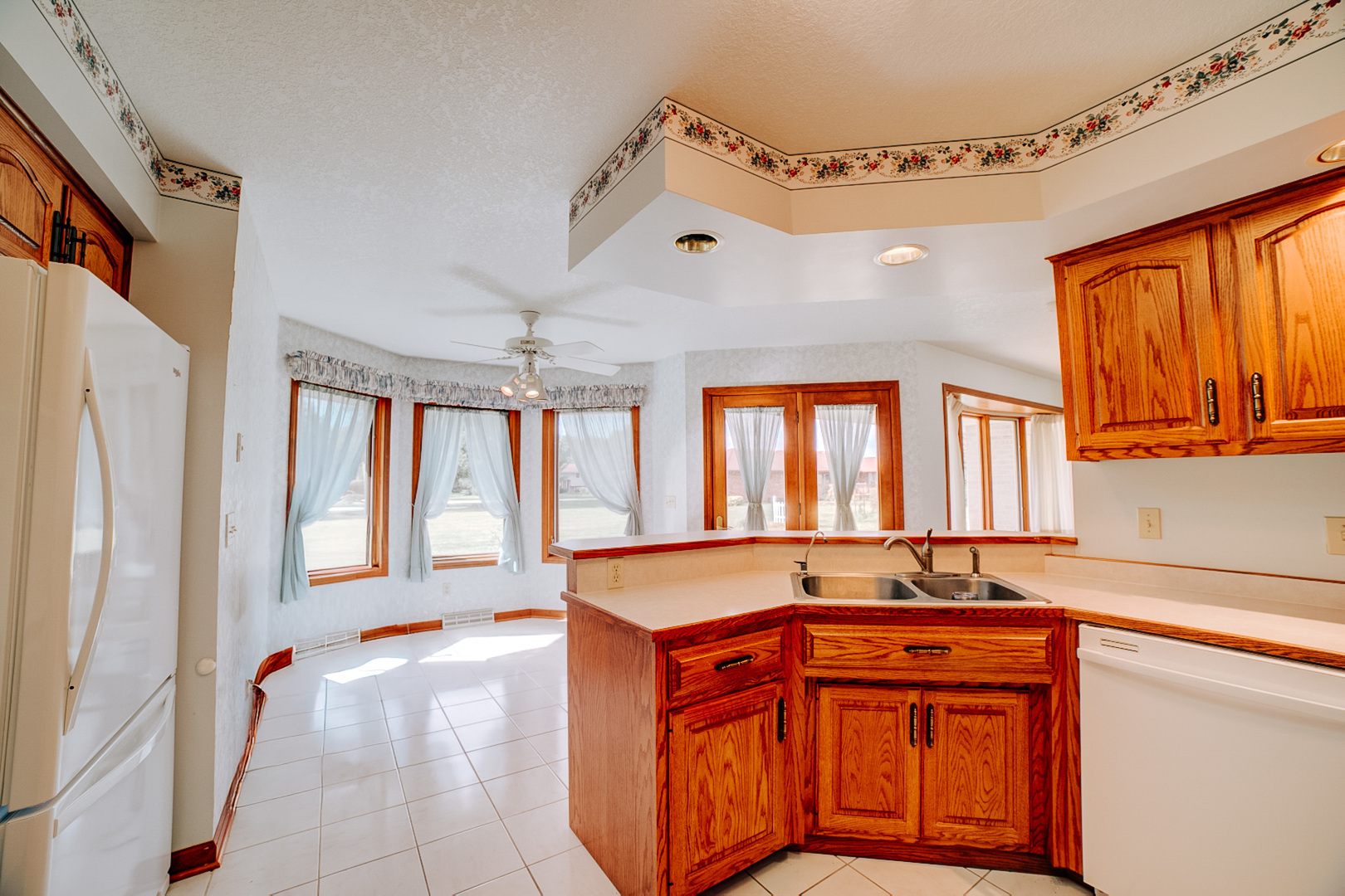 601 Church Street Crescent City, IL 60928 - Photo 22 of 60 a large white kitchen with a large window