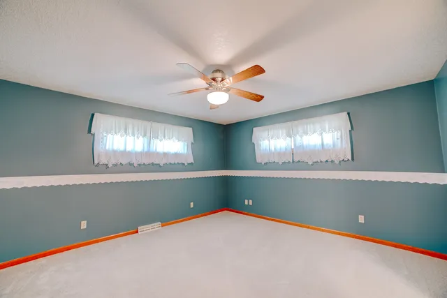 a bathroom with a toilet sink and shower