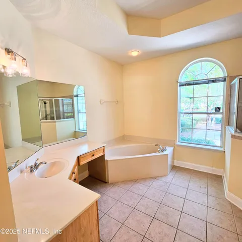 a view of a park with large trees