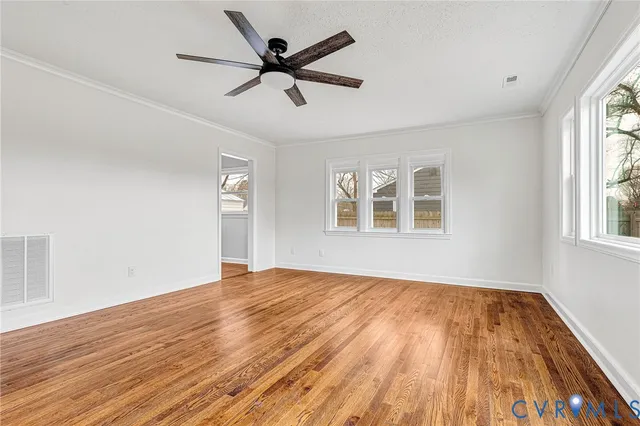 a view of walk in closet with window and bathroom