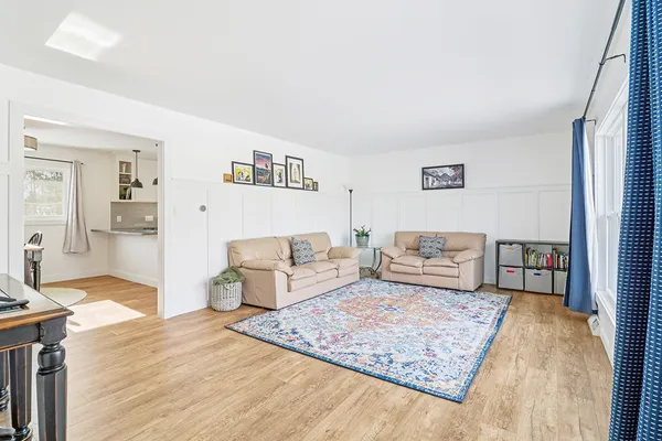 a living room with furniture and a rug