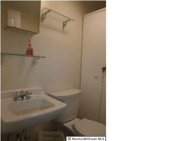 a bathroom with a sink and a toilet