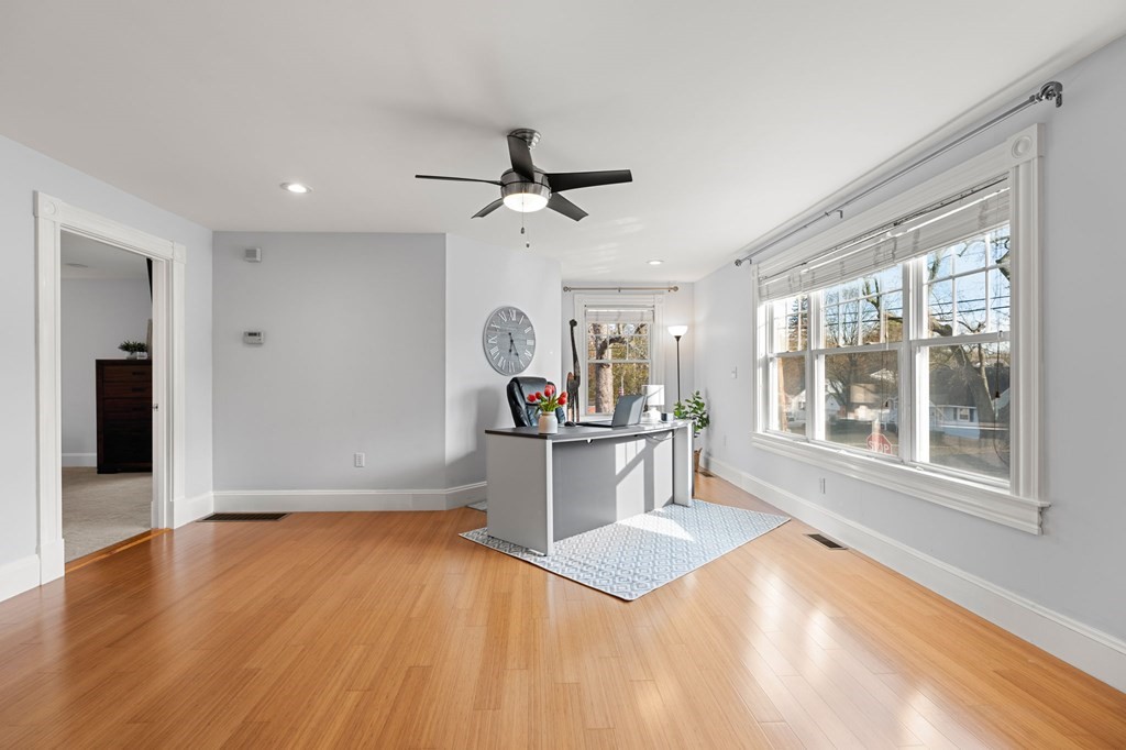 60 Florence Street Lowell, MA 01852 - Photo 13 of 42 a living room with stainless steel appliances kitchen island granite countertop furniture and a large window