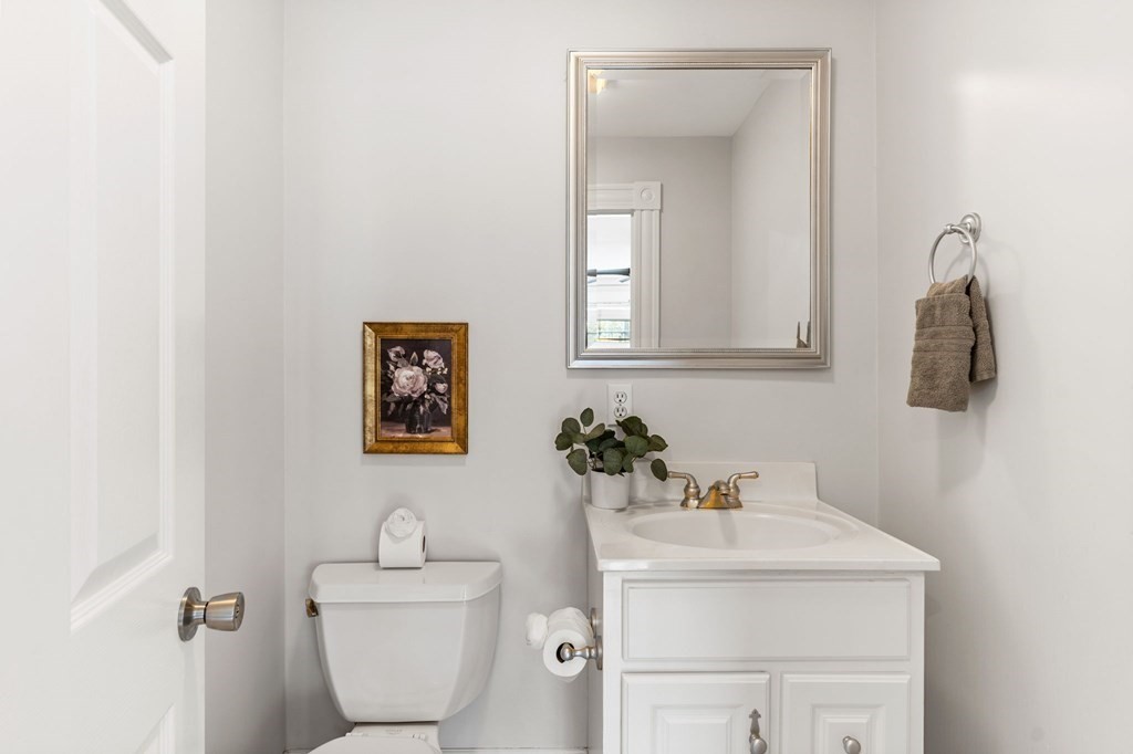 60 Florence Street Lowell, MA 01852 - Photo 16 of 42 a bathroom with a sink mirror and toilet