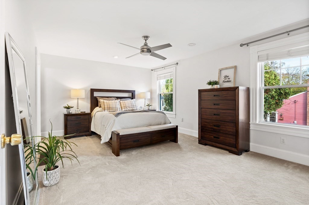 60 Florence Street Lowell, MA 01852 - Photo 17 of 42 a bedroom with a bed and a window