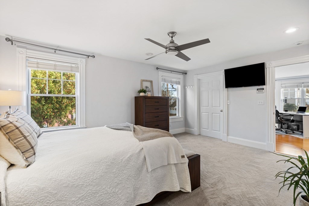 60 Florence Street Lowell, MA 01852 - Photo 19 of 42 a bedroom with a bed and a television