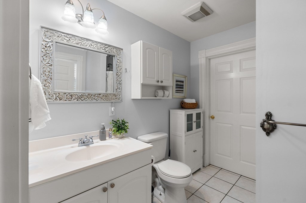 60 Florence Street Lowell, MA 01852 - Photo 20 of 42 a bathroom with a sink a toilet and shower