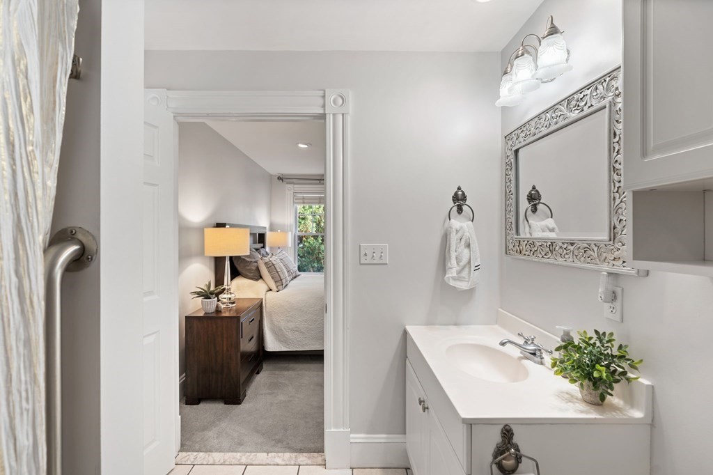 60 Florence Street Lowell, MA 01852 - Photo 21 of 42 a en suite bathroom with a sink double vanity and mirror