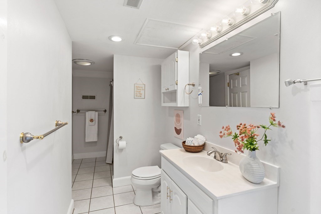 60 Florence Street Lowell, MA 01852 - Photo 32 of 42 a bathroom with a sink toilet and shower