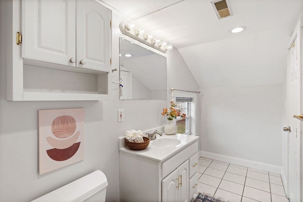 60 Florence Street Lowell, MA 01852 - Photo 33 of 42 a kitchen with a sink and cabinets