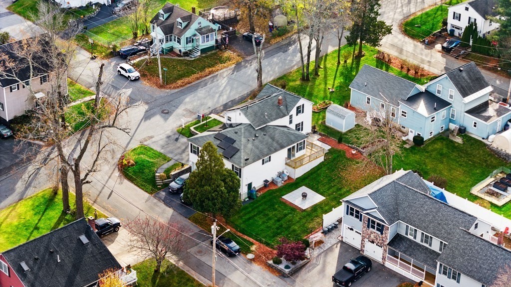 60 Florence Street Lowell, MA 01852 - Photo 39 of 42 an aerial view of a house with a yard and tennis court