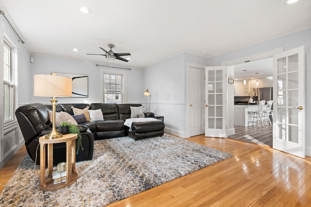 60 Florence Street Lowell, MA 01852 - Photo 5 of 42 a living room with furniture and a wooden floor