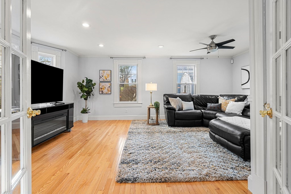 60 Florence Street Lowell, MA 01852 - Photo 6 of 42 a living room with furniture and a flat screen tv