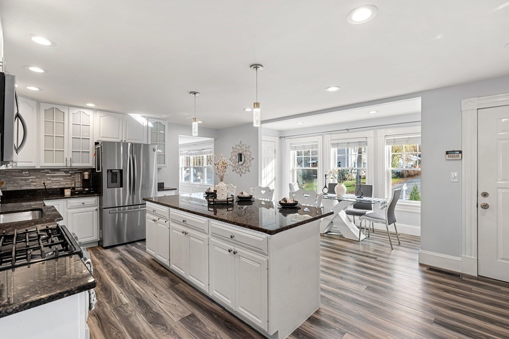 60 Florence Street Lowell, MA 01852 - Photo 10 of 42 a kitchen with a sink stove and refrigerator