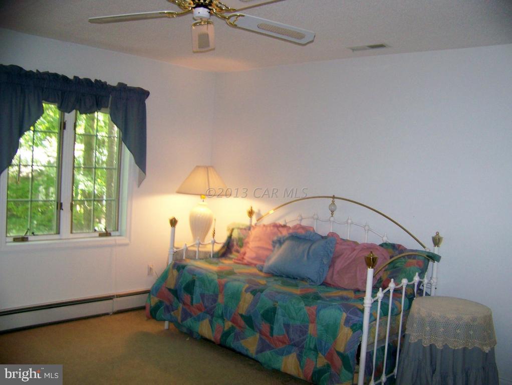 8 Pinehurst Road Ocean Pines, MD 21811 - Photo 14 of 25 a bedroom with a bed and a window