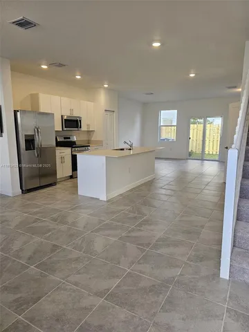 a view of kitchen with windows