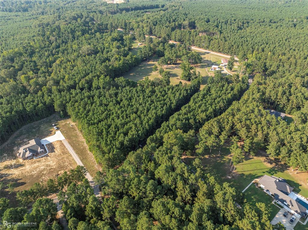 190 Linton Bellevue Road Benton, LA 71006 - Photo 12 of 13 Aerial view of property and surrounding area with a heavily wooded area