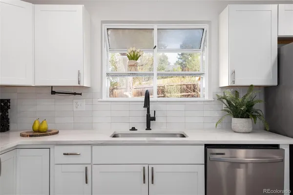 a kitchen with a sink and window