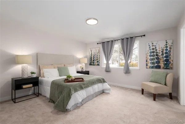 a bedroom with a bed and a couch