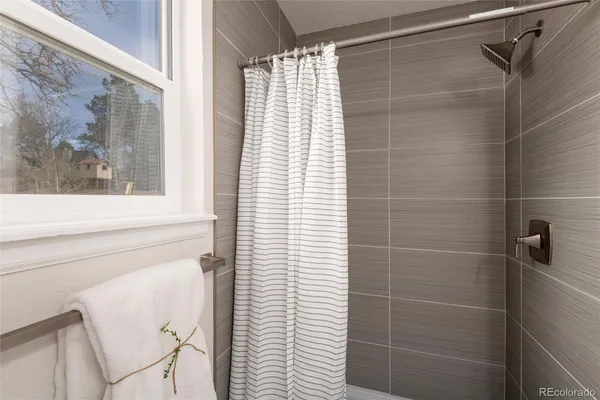 a bathroom with a shower and a bathtub
