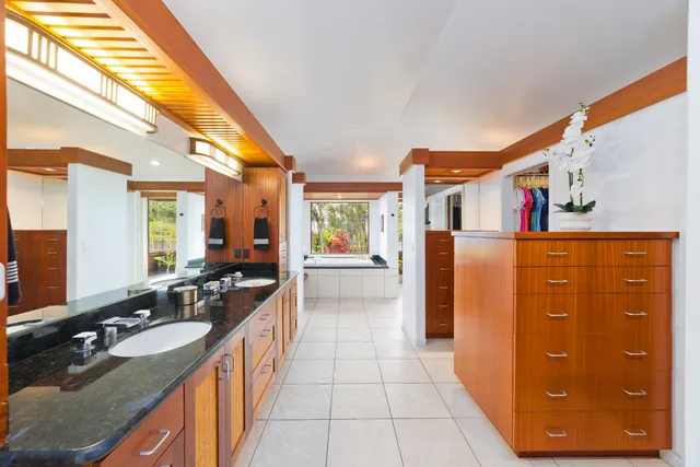 a bathroom with a bathtub and a window