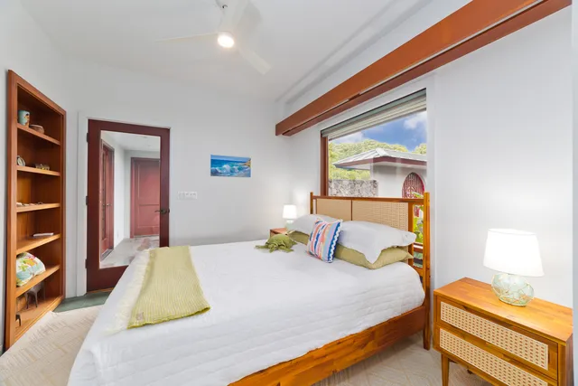 a bathroom with a granite countertop sink a toilet and mirror