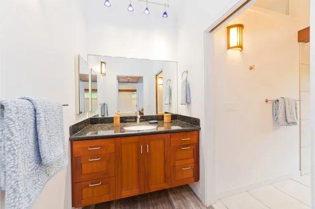 a room with pool table and a potted plant