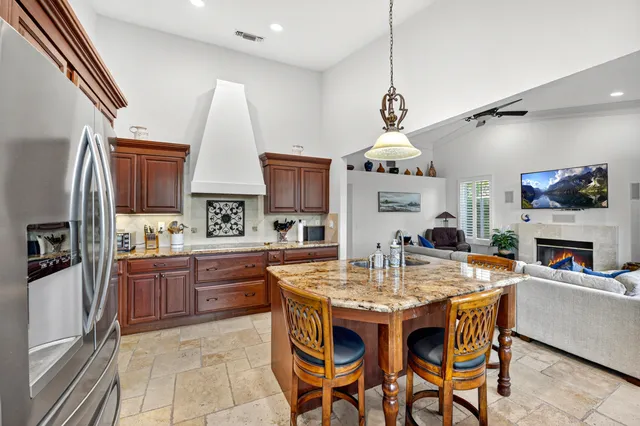 a kitchen with a large window and a sink