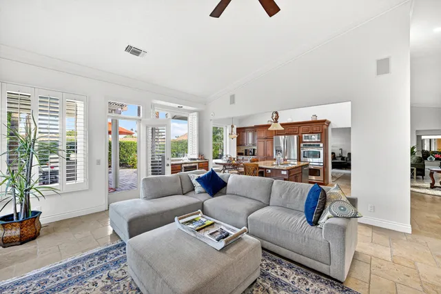 a living room with fireplace furniture and a flat screen tv