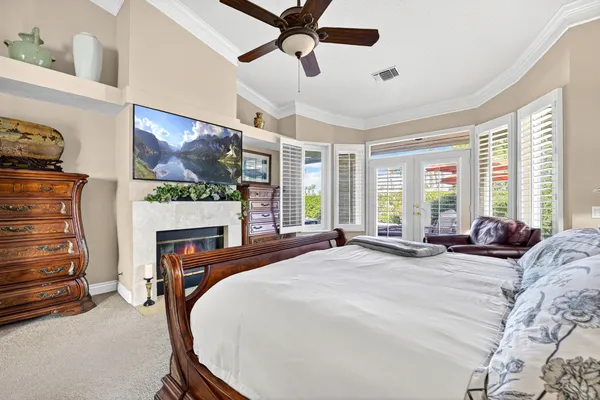 a spacious bathroom with a granite countertop sink and a large mirror