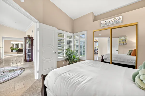 a bathroom with a granite countertop sink a toilet and shower