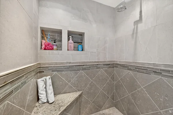a view of a patio with table and chairs potted plants and palm trees