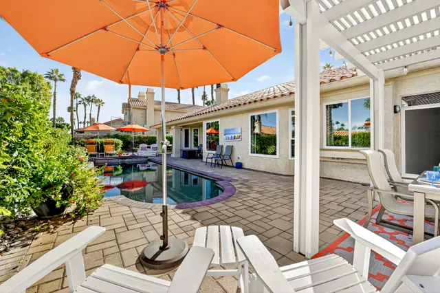 a kitchen with a table and chairs in it