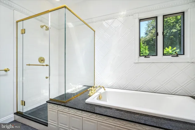 a bathroom with a sink granite and a vanity
