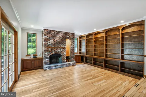 a view of a room with a wooden floor