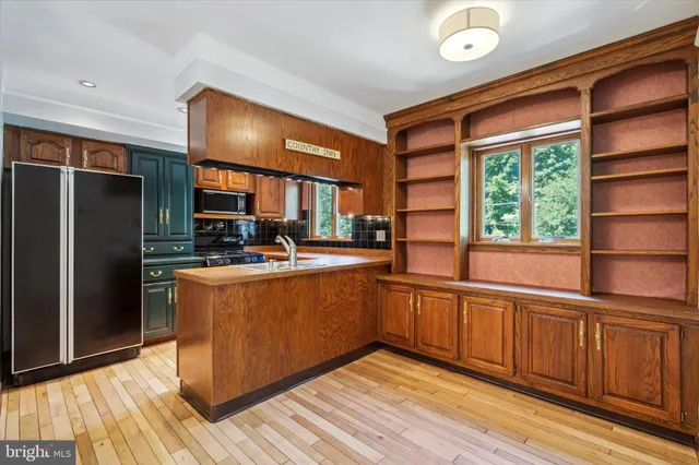 a kitchen with a sink and a window