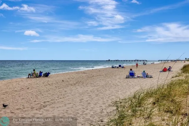 a kitchen with stainless steel appliances granite countertop a stove a refrigerator and a stove