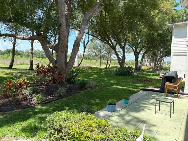 a view of a backyard with sitting area