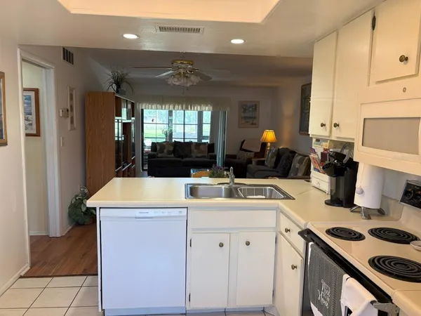 a kitchen with a stove and a refrigerator
