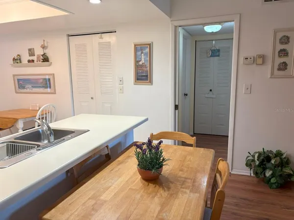 a kitchen with a sink and a refrigerator
